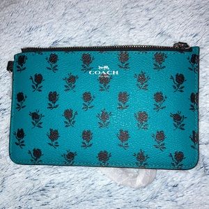 NEW. COACH small wristlet. Turquoise with black roses. NWT